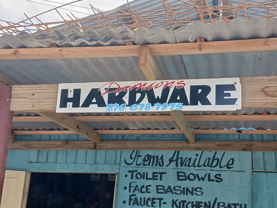 The hand-painted Hardware sign with phone number